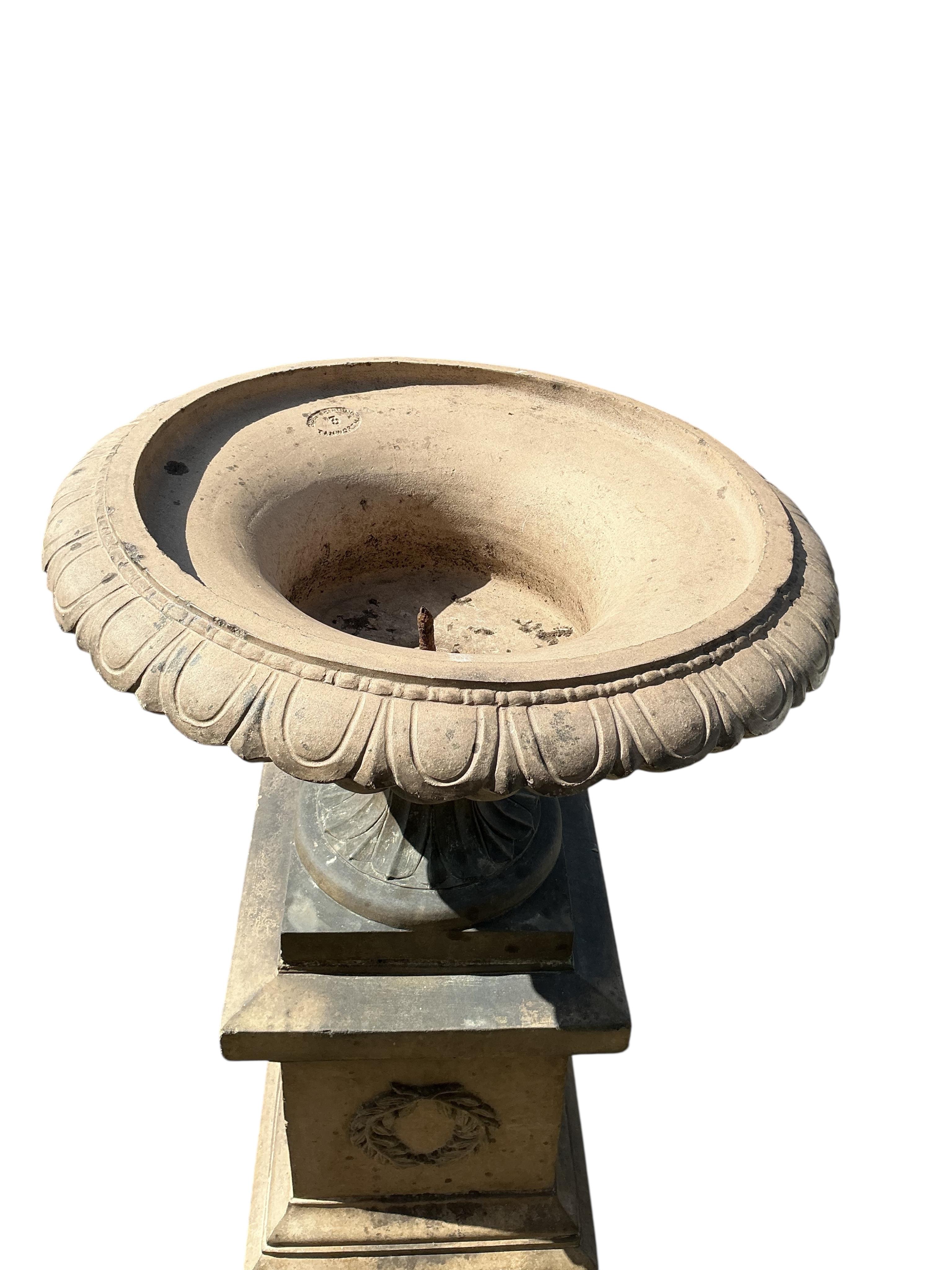 A Victorian Gibbs & Canning, Tamworth earthenware garden campana urn, on square pedestal base, diameter 65cm, height 113cm
